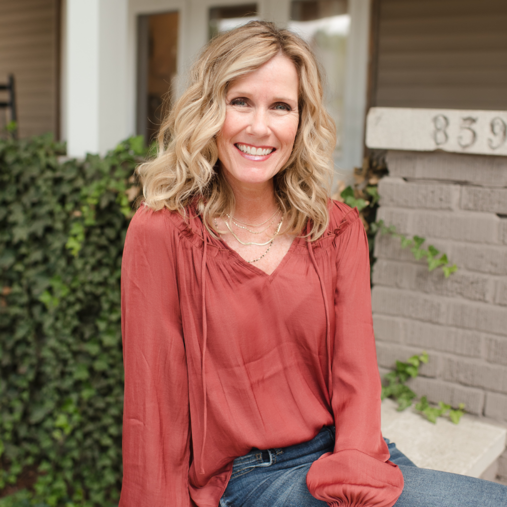Grit Into Grace Founder Stefanie Jeffers sits on the front steps of The Dream House in Indianapolis